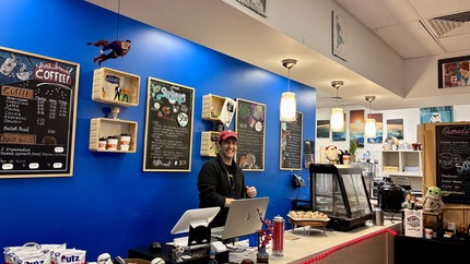 Friendly cashier at Hero's Kafe