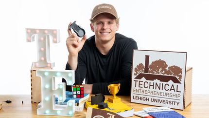 TE student showing off his product